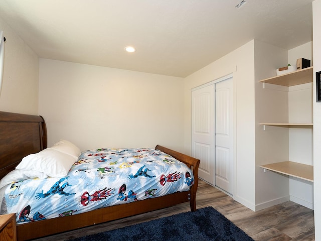 871 Conrad Dr, Kalispell, MT 59901 - bedroom featuring wood finished floors, a closet, recessed lighting, and baseboards