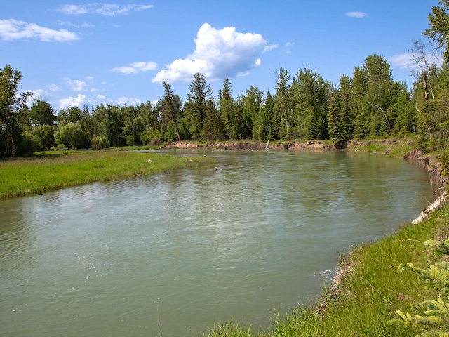 871 Conrad Dr, Kalispell, MT 59901 - water view with a heavily wooded area