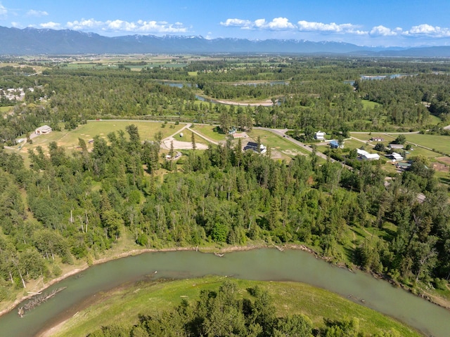 871 Conrad Dr, Kalispell, MT 59901 - view of property location with a heavily wooded area and a water and mountain view