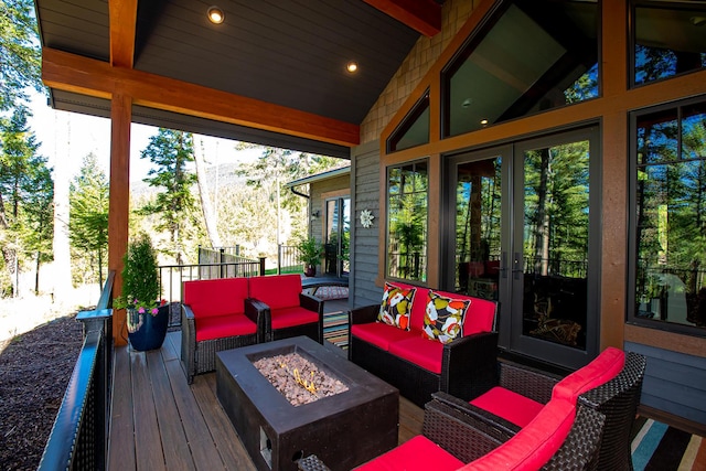 2475 E Lakeshore Dr, Whitefish, MT 59937 - wooden deck featuring an outdoor living space with a fire pit and french doors