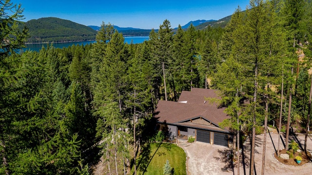 2475 E Lakeshore Dr, Whitefish, MT 59937 - view of subject property with a heavily wooded area and a water and mountain view