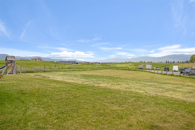 7580 Arroyo Ln, Missoula, MT 59808 - view of yard featuring a view of rural / pastoral area, a playground, and a mountain view