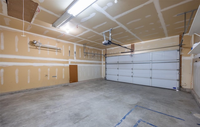 7580 Arroyo Ln, Missoula, MT 59808 - garage with a garage door opener and baseboards