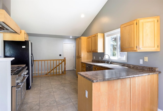 7580 Arroyo Ln, Missoula, MT 59808 - kitchen with wall chimney exhaust hood, stainless steel appliances, lofted ceiling, light brown cabinets, and dark countertops