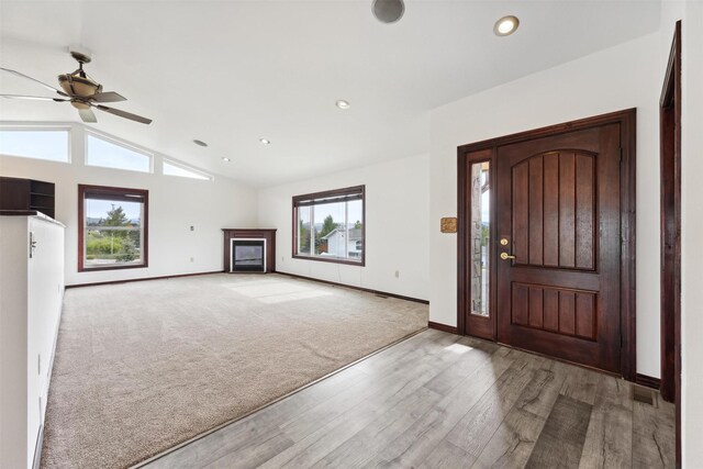 116 Windameer Ct, Butte, MT 59701 - entrance foyer with wood finished floors, baseboards, a ceiling fan, vaulted ceiling, and a fireplace