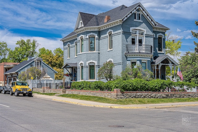 902 N Park Ave, Helena, MT 59601 - victorian home with a balcony and brick siding