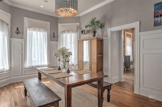 902 N Park Ave, Helena, MT 59601 - dining room with a decorative wall, ornamental molding, wood finished floors, and a wainscoted wall