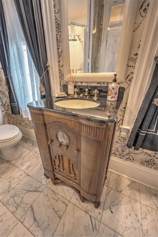 902 N Park Ave, Helena, MT 59601 - bathroom with marble finish flooring, vanity, and toilet