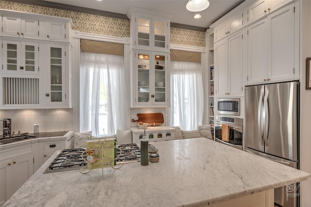 902 N Park Ave, Helena, MT 59601 - kitchen featuring stainless steel appliances, white cabinetry, plenty of natural light, and a sink
