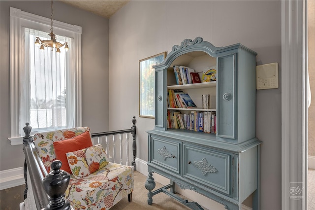 902 N Park Ave, Helena, MT 59601 - sitting room featuring a chandelier, carpet, and baseboards