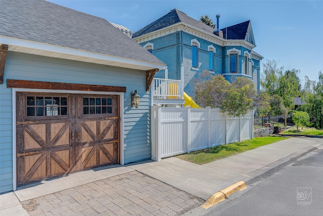 902 N Park Ave, Helena, MT 59601 - view of front of home featuring a shingled roof and a garage