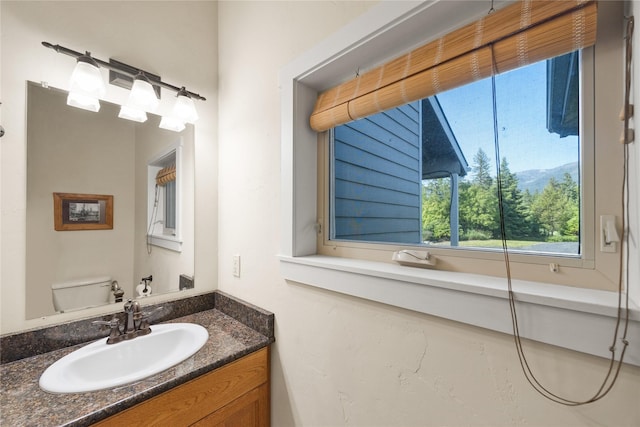13471 Sundance Trl, Bigfork, MT 59911 - bathroom featuring plenty of natural light and vanity
