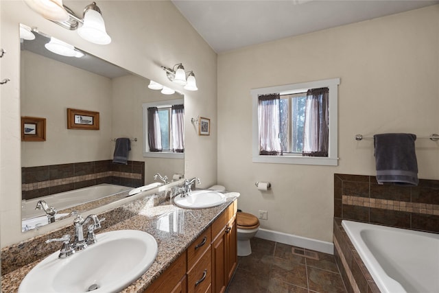 13471 Sundance Trl, Bigfork, MT 59911 - bathroom featuring a bath and double vanity