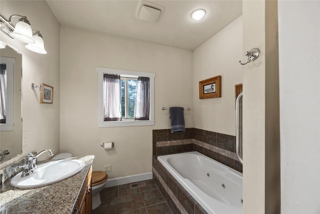13471 Sundance Trl, Bigfork, MT 59911 - full bath featuring a tub with jets and vanity