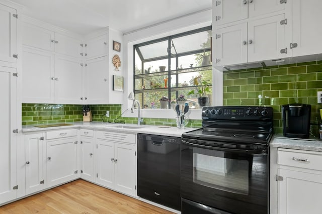 2606 View Dr, Missoula, MT 59804 - kitchen featuring black appliances, a sink, and white cabinets