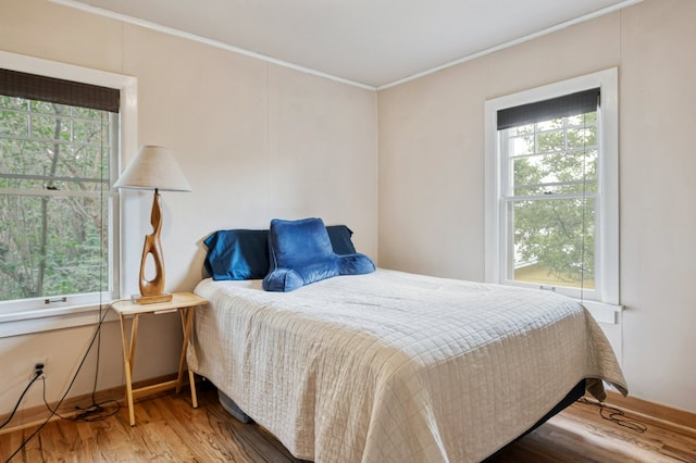 2606 View Dr, Missoula, MT 59804 - bedroom featuring crown molding, multiple windows, and wood finished floors