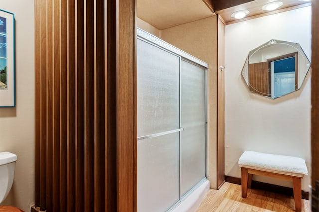 2606 View Dr, Missoula, MT 59804 - bathroom featuring toilet, a stall shower, and wood finished floors