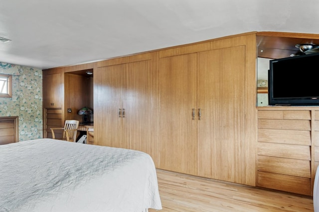 2606 View Dr, Missoula, MT 59804 - bedroom with wallpapered walls and light wood-style flooring
