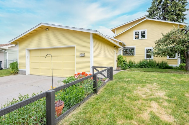 2606 View Dr, Missoula, MT 59804 - view of side of home with concrete driveway, an attached garage, and an outdoor structure