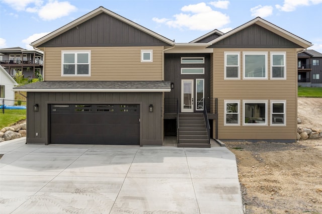 7018 Max Dr, Missoula, MT 59803 - view of front of house with an attached garage, concrete driveway, and roof with shingles