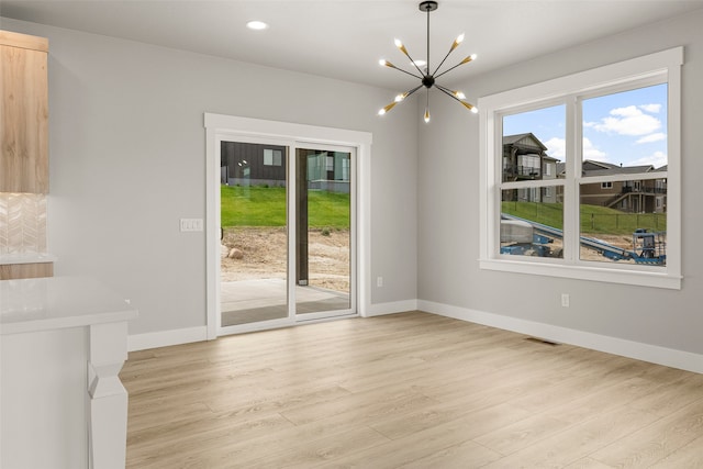 7018 Max Dr, Missoula, MT 59803 - unfurnished dining area with light wood-style floors, a chandelier, baseboards, and recessed lighting