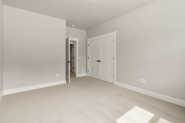 7018 Max Dr, Missoula, MT 59803 - unfurnished bedroom featuring light colored carpet and baseboards