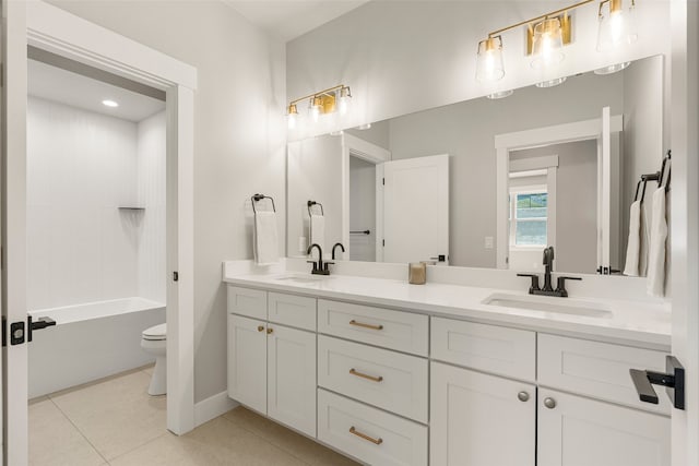 7018 Max Dr, Missoula, MT 59803 - full bath featuring toilet, double vanity, tile patterned flooring, and baseboards