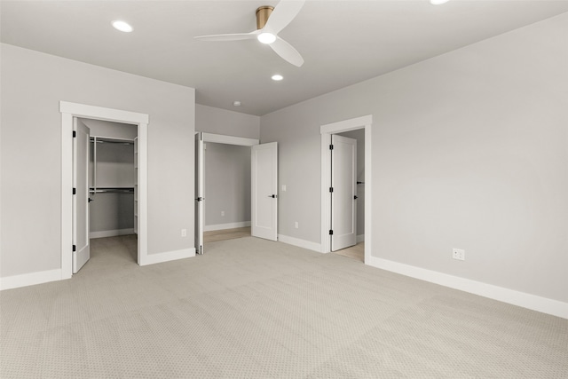 7018 Max Dr, Missoula, MT 59803 - unfurnished bedroom with light carpet, baseboards, a spacious closet, recessed lighting, and a ceiling fan