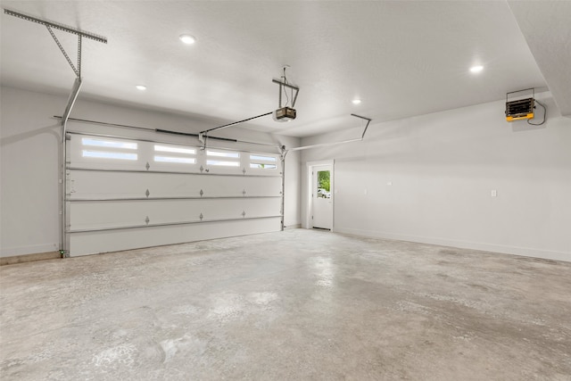 7018 Max Dr, Missoula, MT 59803 - garage with a heating unit, a garage door opener, and recessed lighting