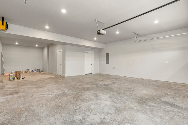 7018 Max Dr, Missoula, MT 59803 - garage featuring a garage door opener, electric panel, recessed lighting, and baseboards