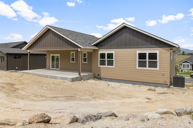 7018 Max Dr, Missoula, MT 59803 - rear view of house featuring a patio area, board and batten siding, and central AC unit