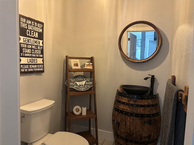 411 10th Ave NE, Choteau, MT 59422 - half bath featuring toilet and vanity