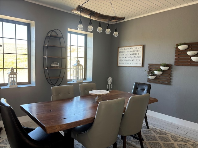 411 10th Ave NE, Choteau, MT 59422 - dining space featuring plenty of natural light, wooden ceiling, ornamental molding, and baseboards