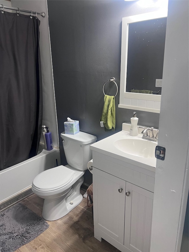 3000 Villard Ave Unit 12, Helena, MT 59601 - full bathroom with toilet, vanity, shower / bathtub combination with curtain, and wood finished floors