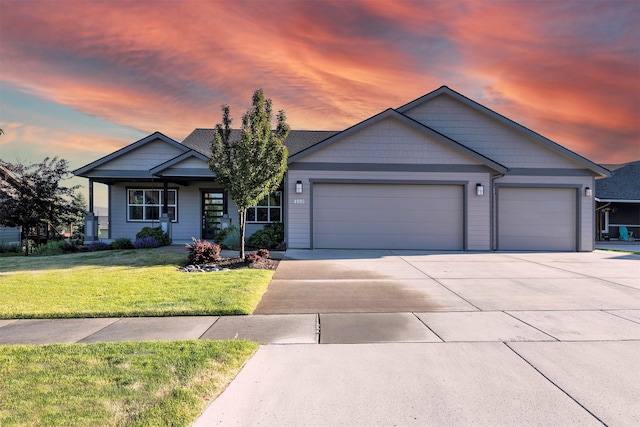 4995 Jeff Dr, Missoula, MT 59803 - view of front facade featuring a garage, concrete driveway, and a front yard
