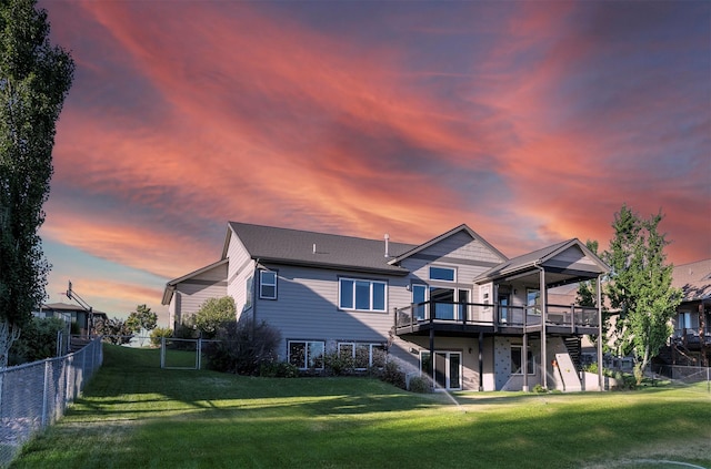 4995 Jeff Dr, Missoula, MT 59803 - back of house featuring a wooden deck and a fenced backyard