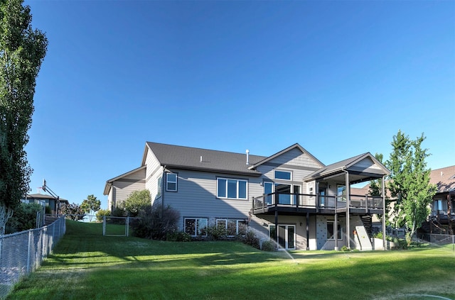 4995 Jeff Dr, Missoula, MT 59803 - back of house with a wooden deck and a fenced backyard