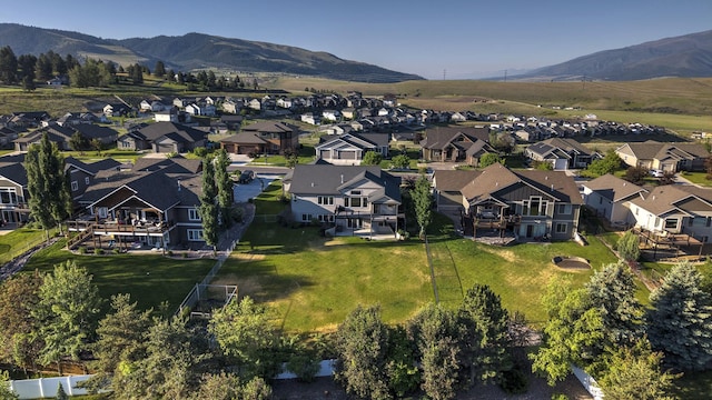 4995 Jeff Dr, Missoula, MT 59803 - aerial view of property and surrounding area with nearby suburban area and a mountainous background