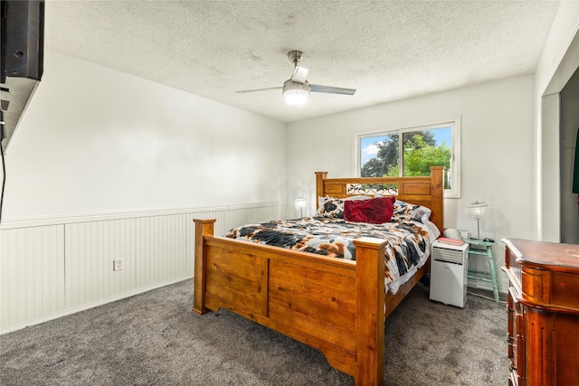 5900 Longview Dr, Missoula, MT 59803 - bedroom featuring carpet flooring, a wainscoted wall, a textured ceiling, and ceiling fan