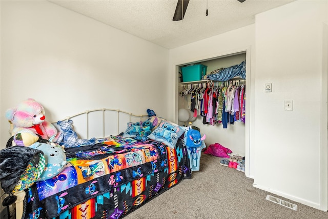 5900 Longview Dr, Missoula, MT 59803 - bedroom with carpet floors, a closet, a ceiling fan, a textured ceiling, and baseboards