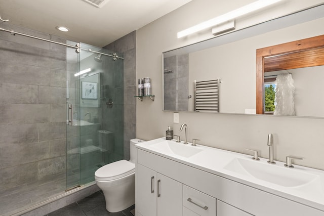 100 N Low Bench Rd, Gallatin Gateway, MT 59730 - bathroom featuring a stall shower, toilet, double vanity, tile patterned flooring, and radiator heating unit