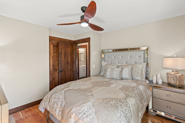 100 N Low Bench Rd, Gallatin Gateway, MT 59730 - bedroom with wood finished floors, a closet, ceiling fan, and baseboards