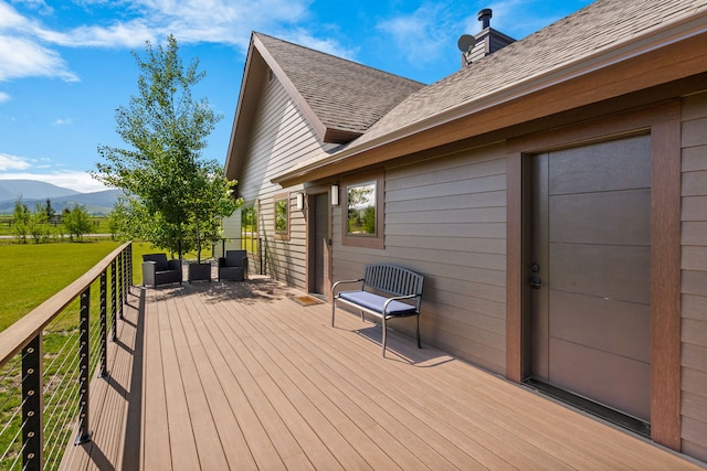 100 N Low Bench Rd, Gallatin Gateway, MT 59730 - wooden terrace with a mountain view and a lawn