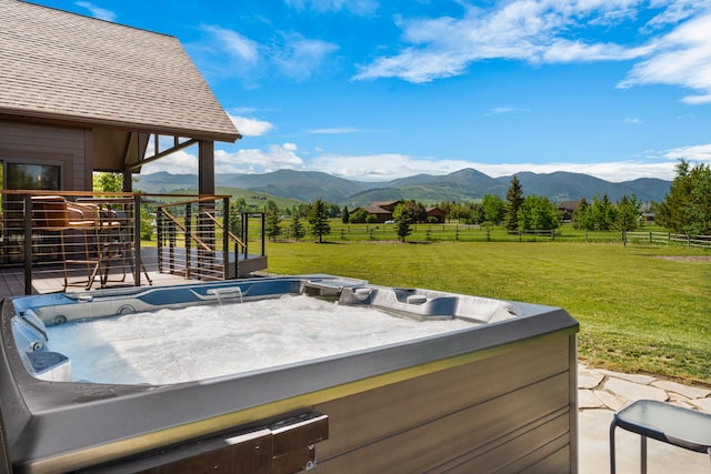 100 N Low Bench Rd, Gallatin Gateway, MT 59730 - view of patio with a hot tub, a mountain view, and a view of countryside