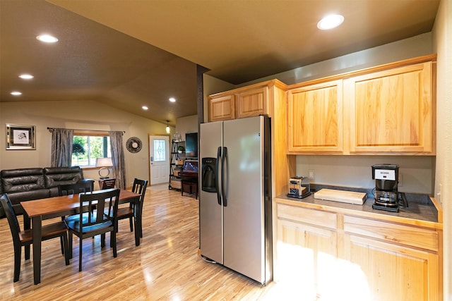 5334 Woodrow Ln, Lolo, MT 59847 - kitchen with stainless steel fridge with ice dispenser, light brown cabinets, light wood-style floors, recessed lighting, and lofted ceiling