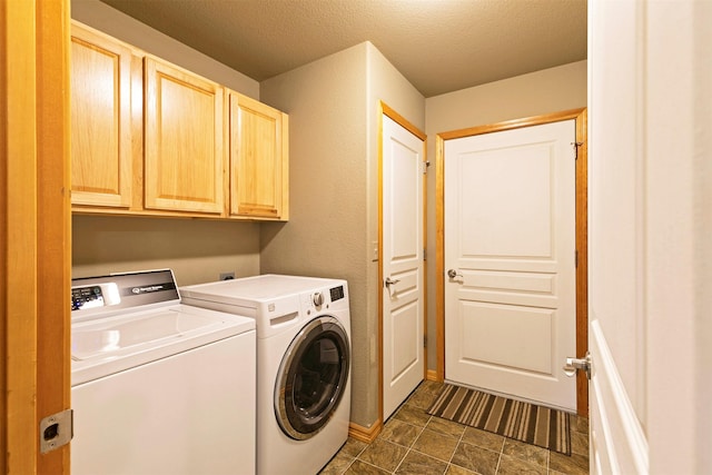 5334 Woodrow Ln, Lolo, MT 59847 - laundry room featuring cabinet space, washing machine and clothes dryer, and a textured ceiling