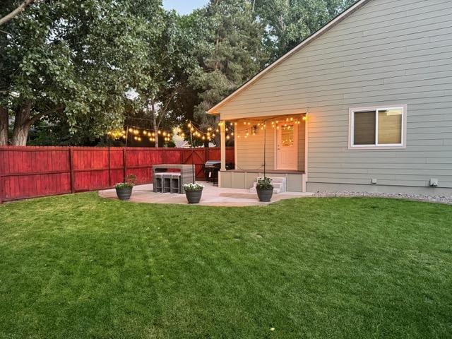 5334 Woodrow Ln, Lolo, MT 59847 - back of house featuring a patio area and a fenced backyard