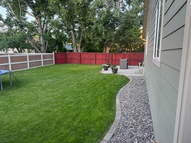 5334 Woodrow Ln, Lolo, MT 59847 - fenced backyard with a patio area