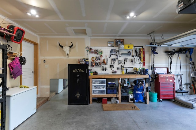 5334 Woodrow Ln, Lolo, MT 59847 - garage with a workshop area, fridge, and a garage door opener