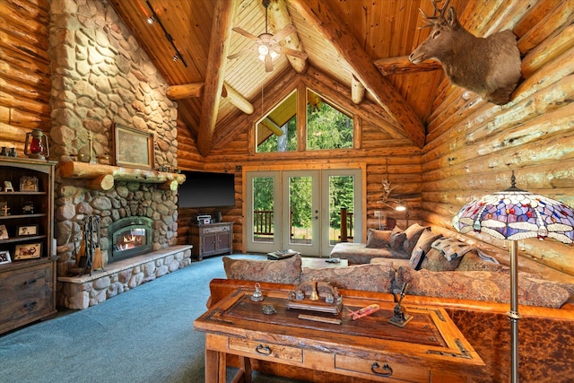 421 Swanson Lodge Rd, Troy, MT 59935 - carpeted living room featuring rustic walls, wooden ceiling with exposed beams, high vaulted ceiling, french doors, and a fireplace